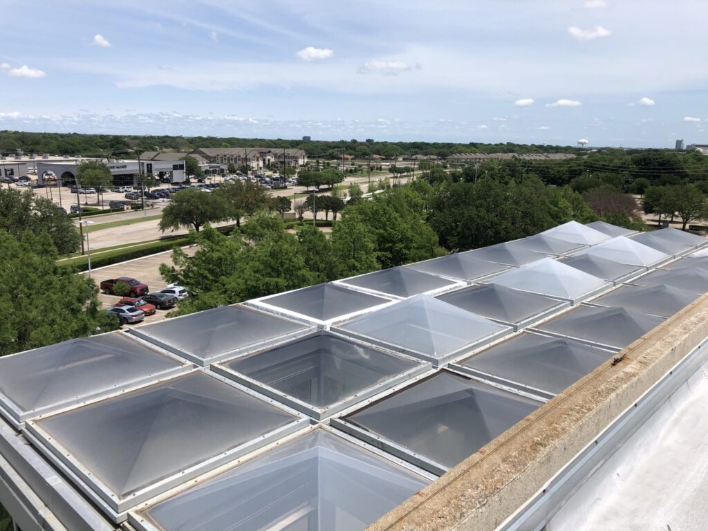 Silicone roof coating flooded around skylight frame seals at the AT&T Plano campus
