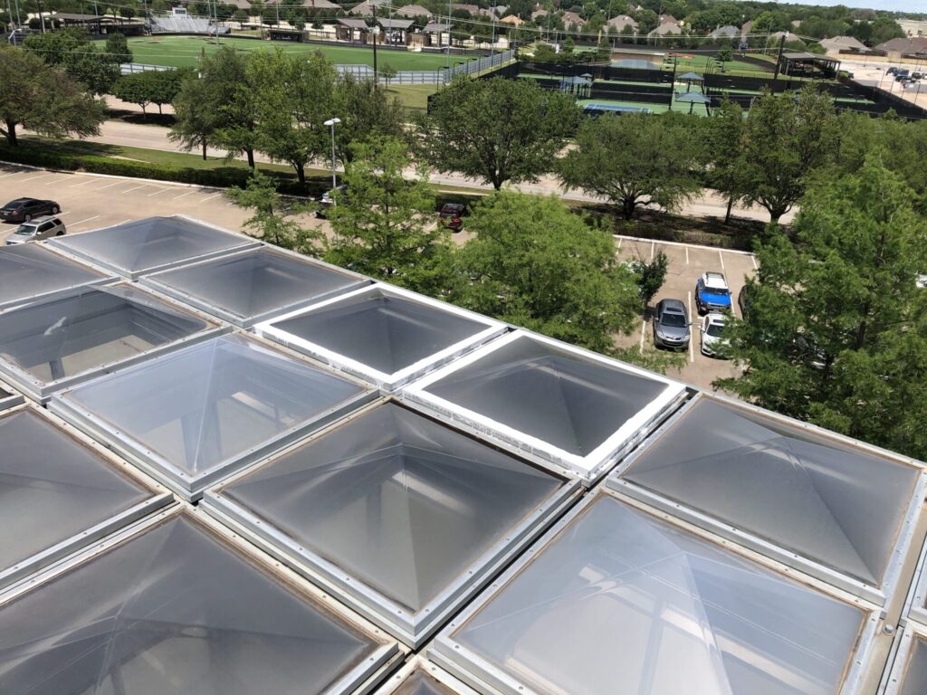 Sealed skylight dome frames after silicone repair at AT&T's Plano campus