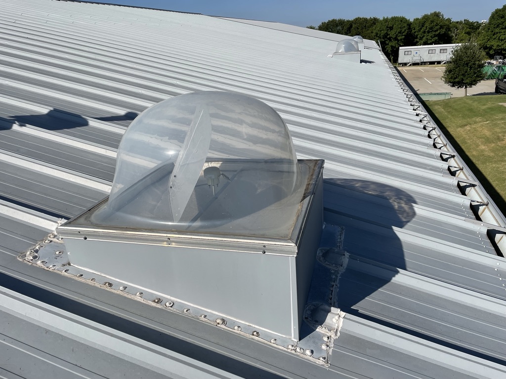 Failed urethane sealant where the skylight curb bonds to the standing seam roof, Legacy Dr, Plano