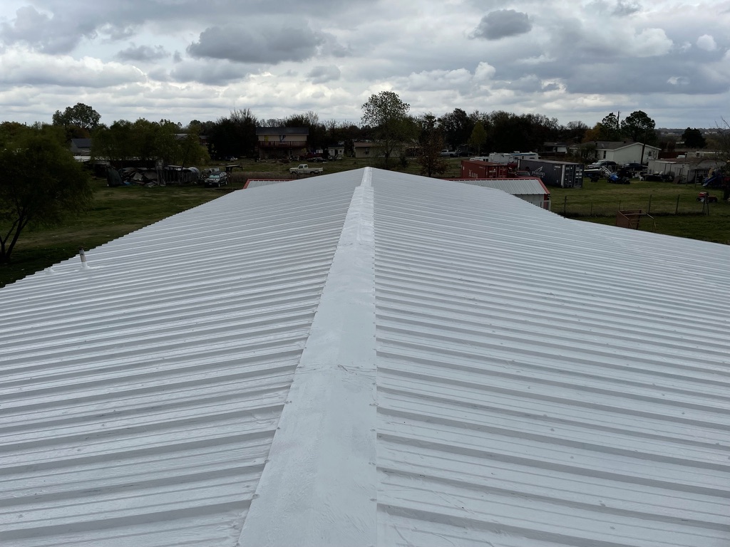 Silicone roof coating application over the existing metal R-panel roof at Princeton Fire Department Station 4