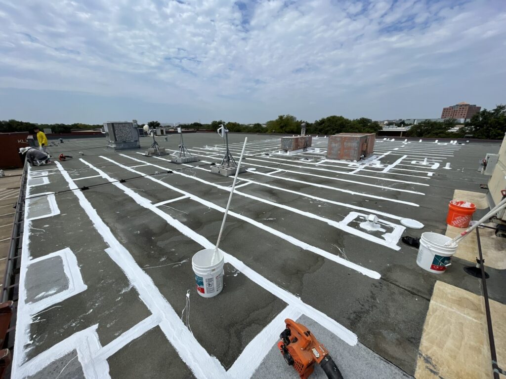 Silicone applied to field membrane seams on the three-building commercial complex in Richardson, Texas