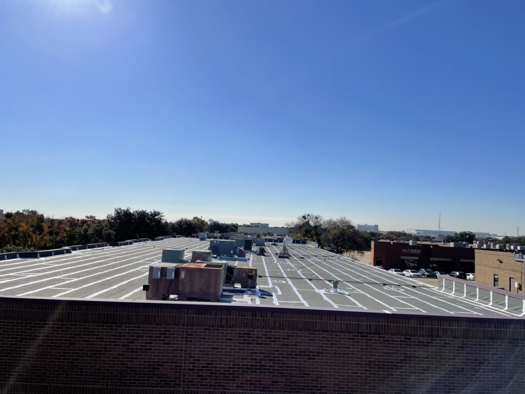 Completed commercial roof leak repair across the three-building complex at 1910 Firman Dr, Richardson, Texas