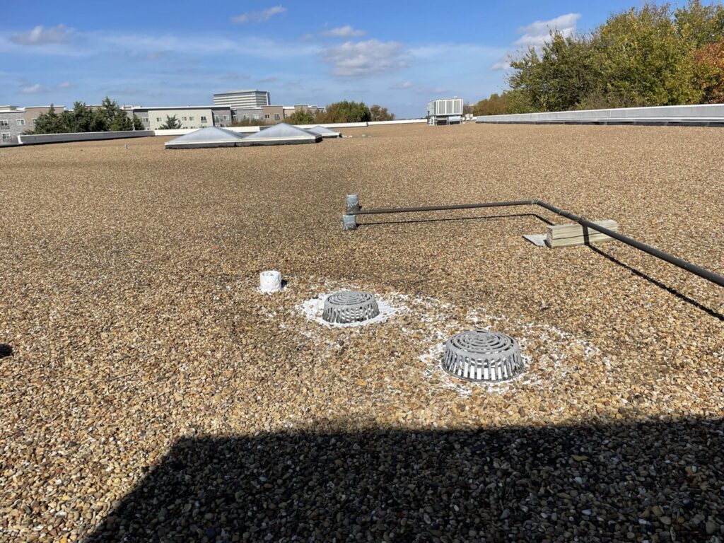 Silicone flood coat applied at the primary and secondary roof drains on the AT&T leased property, Richardson, TX