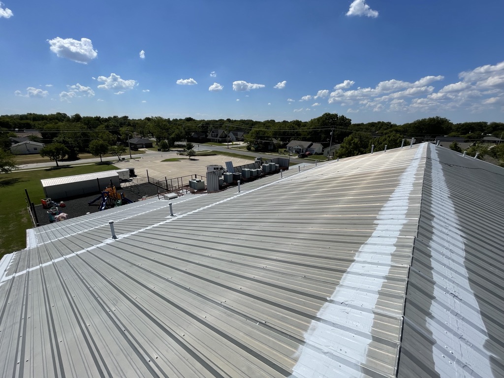 3-coursed horizontal seams and penetrations on metal roof at Church of Christ, Sanger, Texas