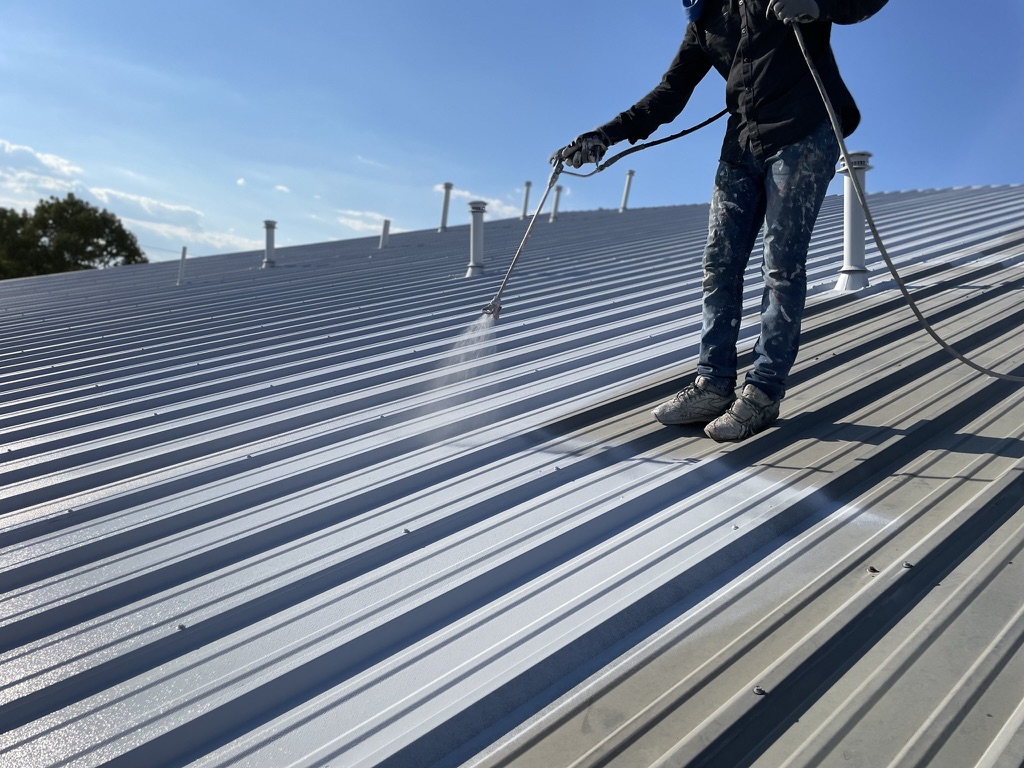 Custom grey acrylic roof coating blending with wall colors at Church of Christ, 400 Locust St, Sanger