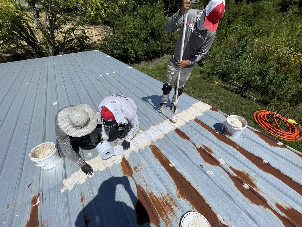 Gun foam installed between the ridge cap and R-panel roof to create a tight seal, Van Alstyne, Texas