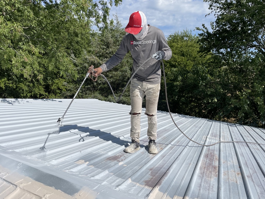 Gray Armor Coat acrylic roof coating applied over the metal R-panel roof, Wolf Front Rd and FM-3133