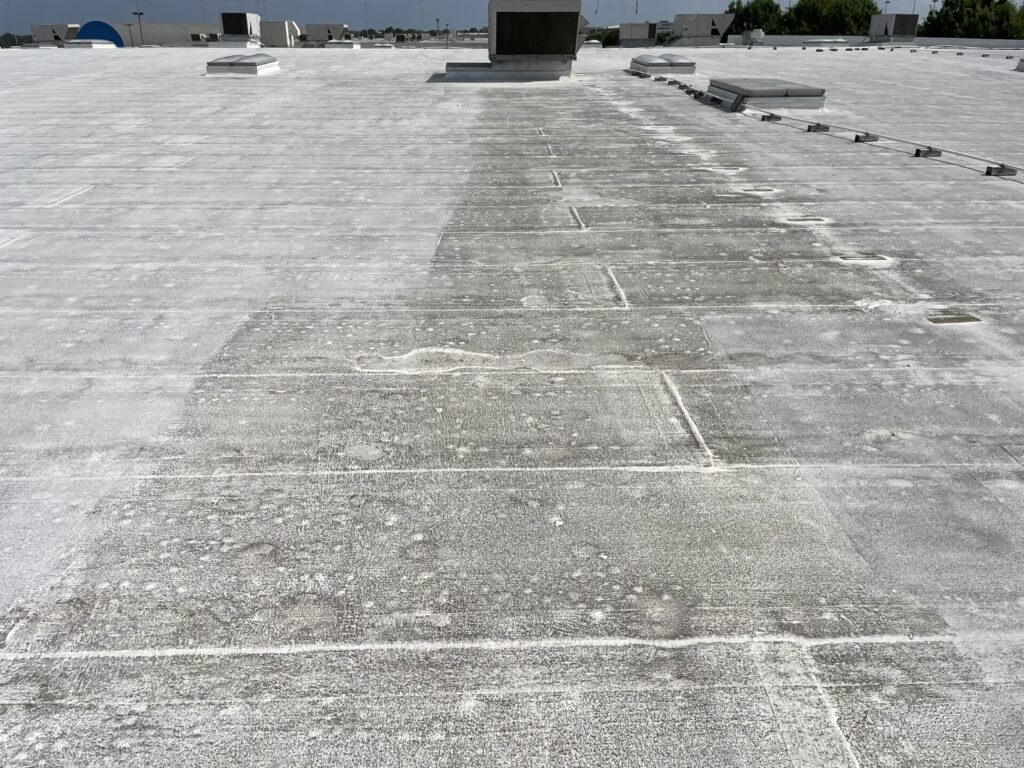 Ponding damage on the high slope side of an RTU where a cricket should have been installed, Arlington, TX
