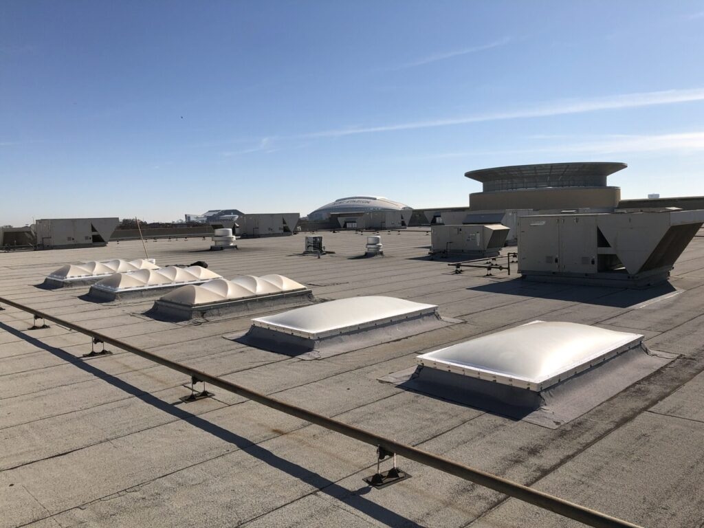 Leaking skylight on the Modified Bitumen roof at LA Fitness in Arlington's Entertainment District, TX