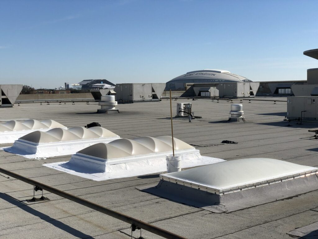 Silicone roof coating applied over the skylight curb at LA Fitness near AT&T Stadium, Arlington