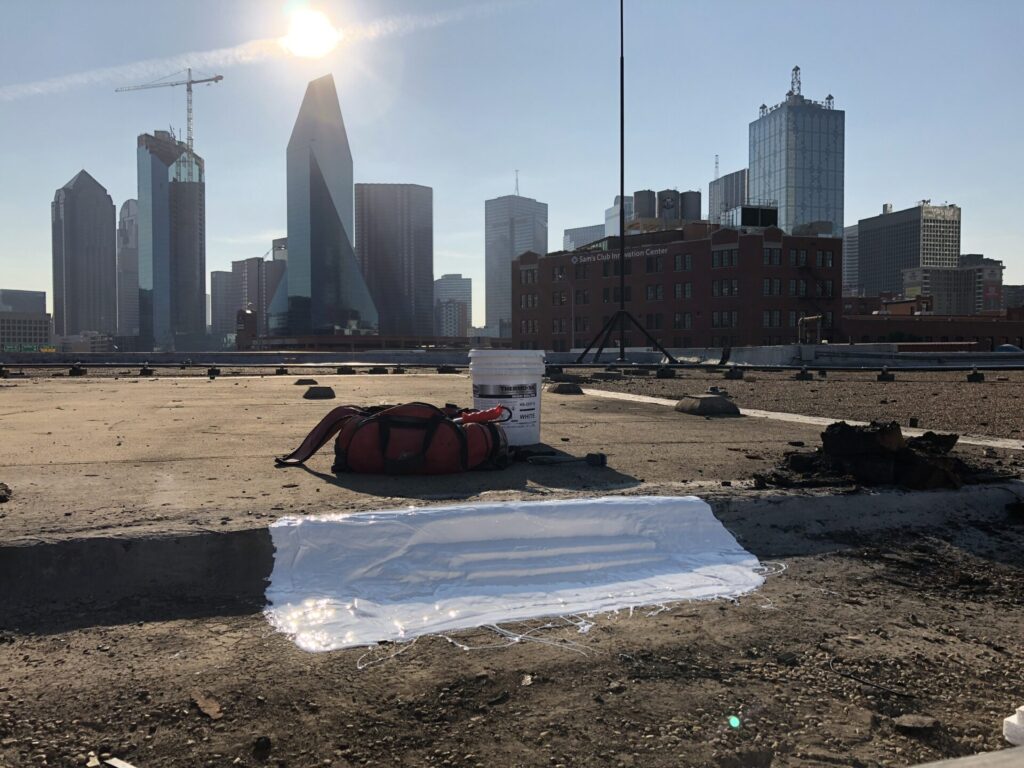 Damaged area built up with EPS board and flooded with high solids silicone, downtown Dallas, TX