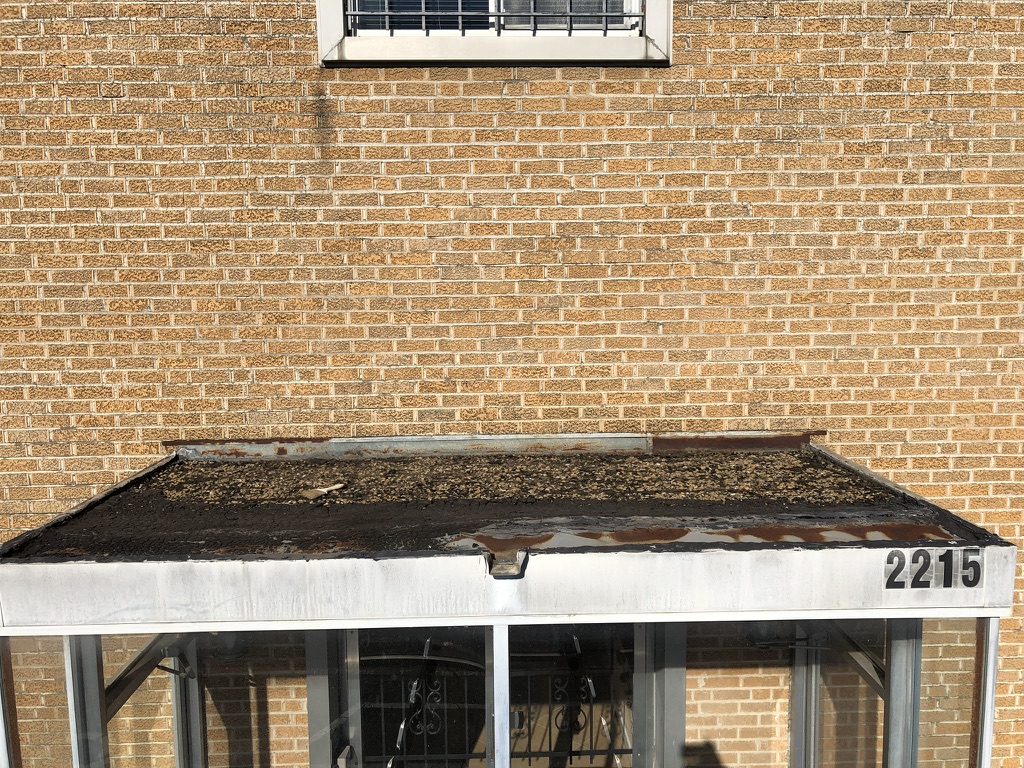 Leaking scupper drain at the rear of Victory Kids Christian Academy, 2215 Lanark Ave, South Dallas, TX
