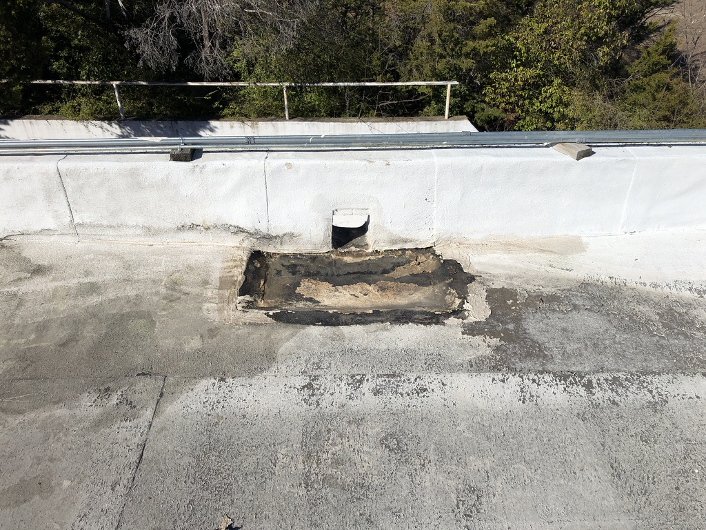 Silicone roof coating applied over the entry roof section, Bonnie View Rd and Lanark Ave, Dallas, TX