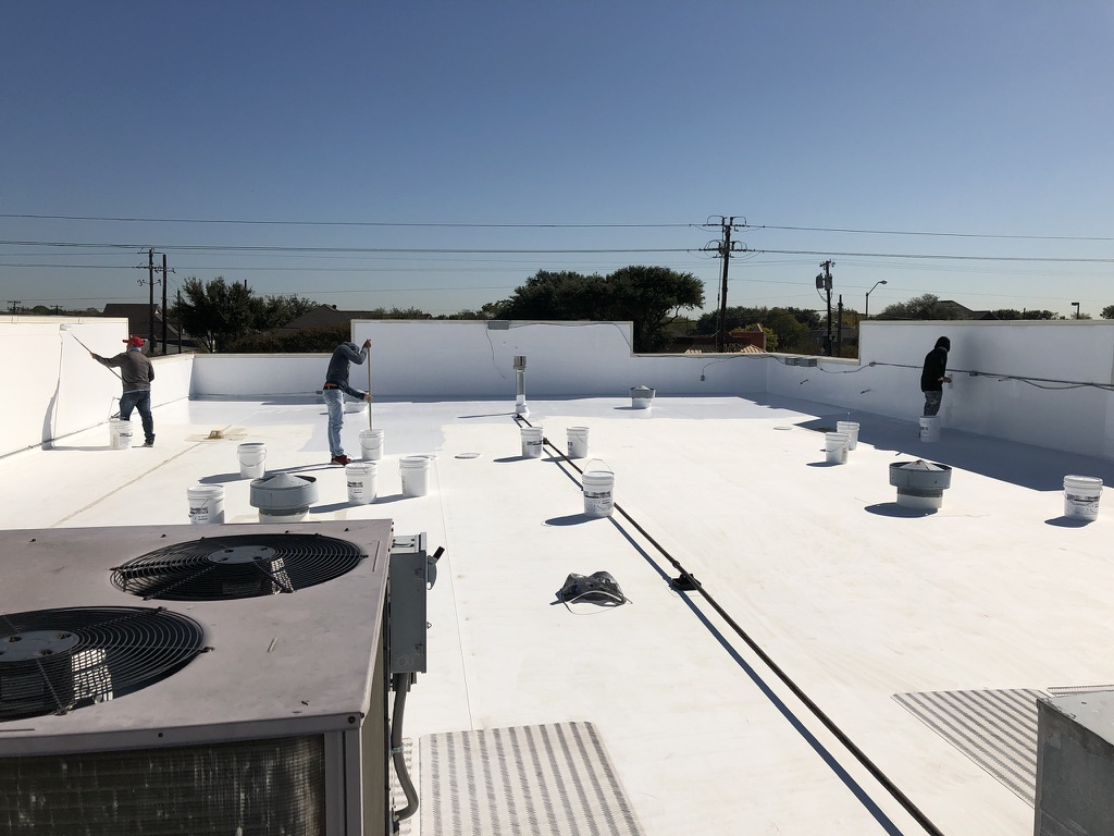 Metal coping cap seams seal coated ahead of the silicone application, Duncanville, Texas