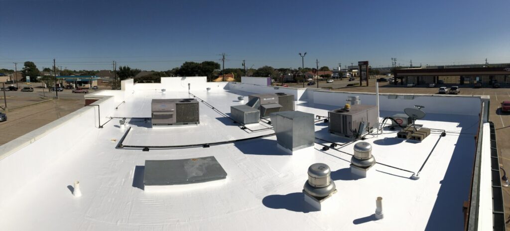 Completed silicone roof coating over the existing TPO system at W Wheatland Rd, Duncanville, TX