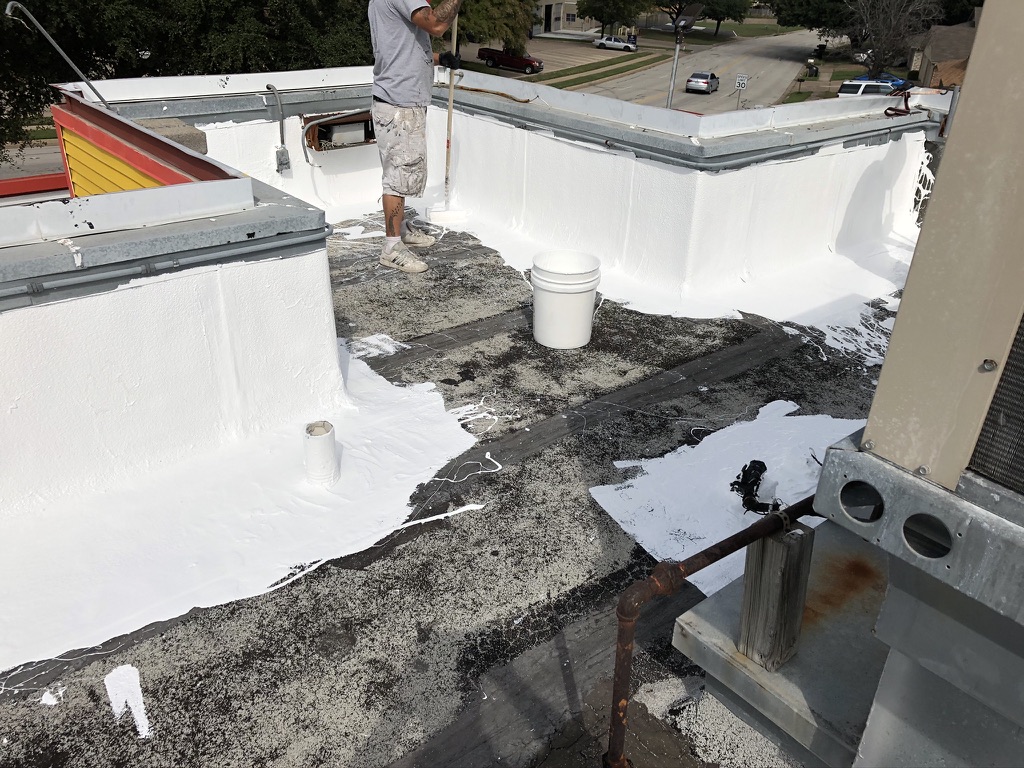 Bulked silicone applied at the parapet walls and failing seams sealed with silicone mastic, Fort Worth, TX