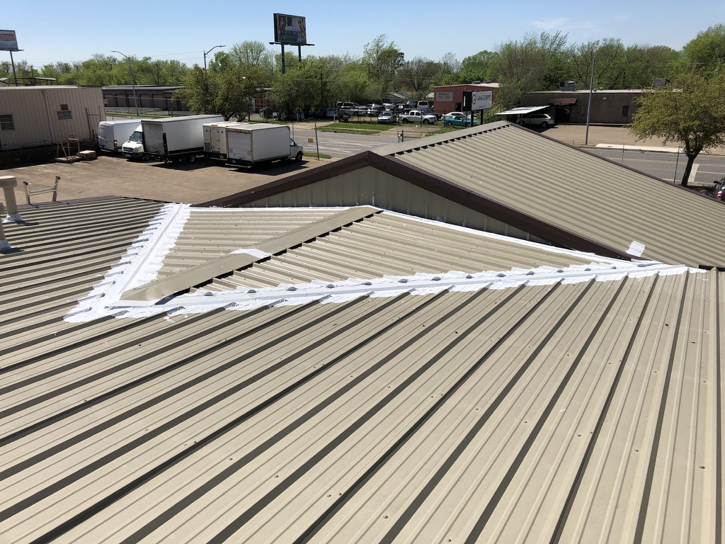 Silicone mastic applied at the wall transition and horizontal seams on the metal roof, Echo Heights, Fort Worth