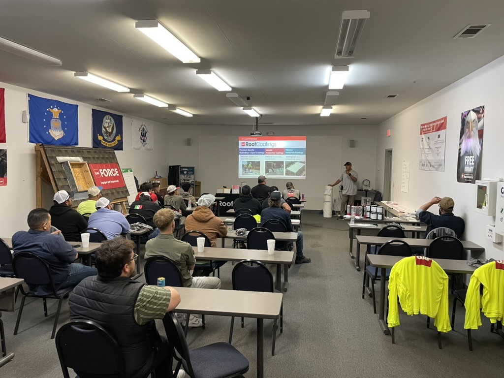 Pepper Coatings team in a GAF roof coatings classroom training session at the Dallas manufacturing facility
