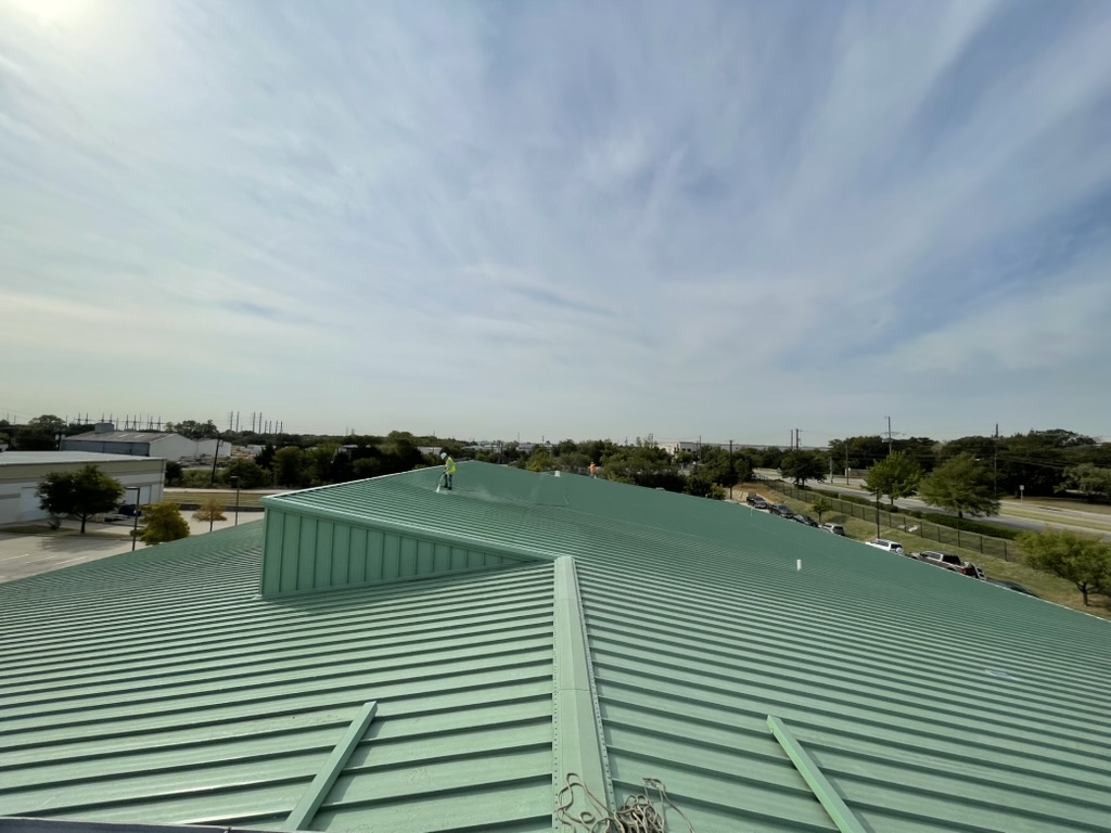 Single lock standing seam metal roof at 5244 Bear Creek Ct in Irving, TX before the acrylic coating