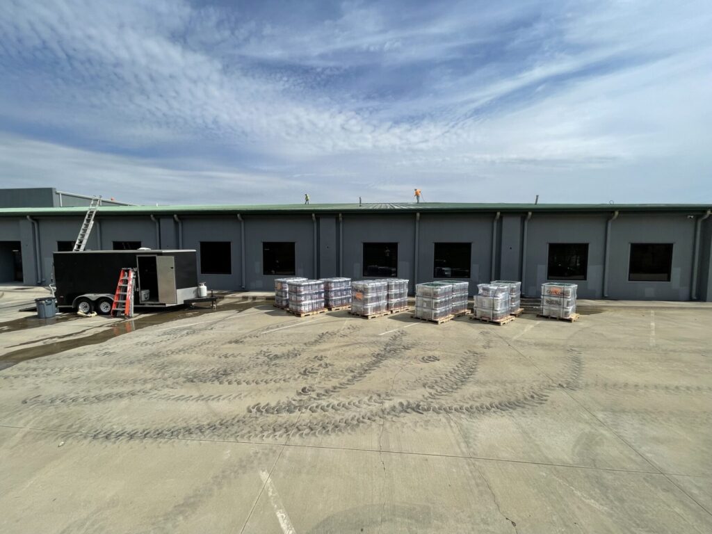 Acrylic mastic spray applied into the vertical seams of the standing seam roof, Irving, TX