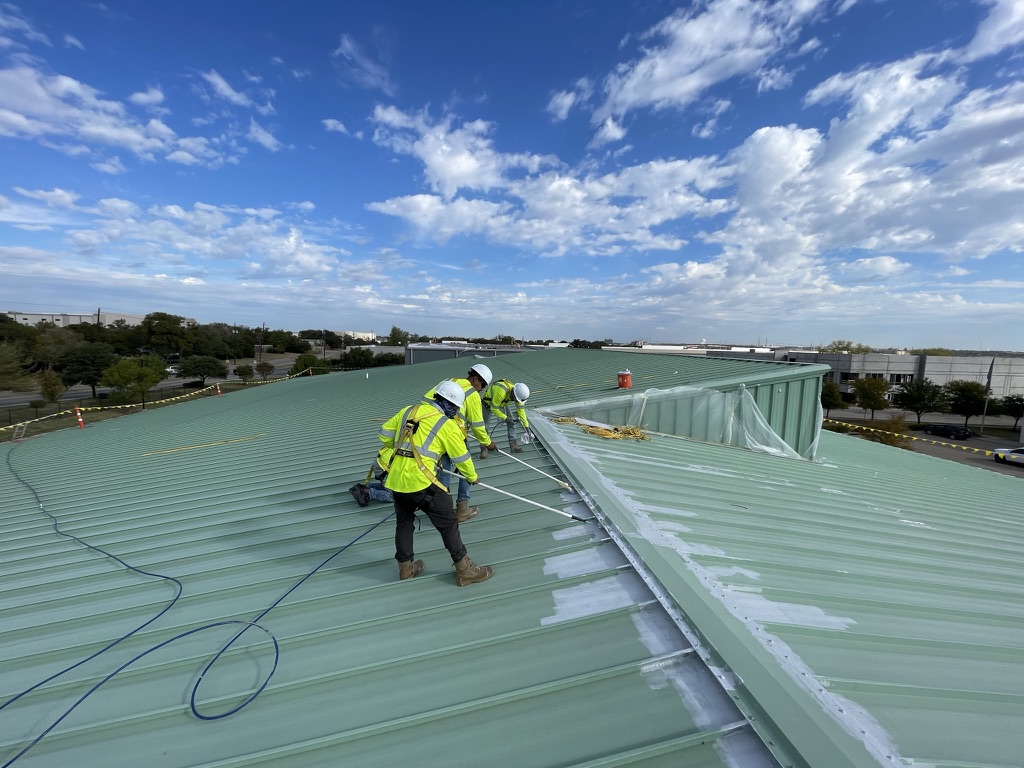 Roof ridge closures sealed with acrylic mastic ahead of the base coat, Irving, Texas