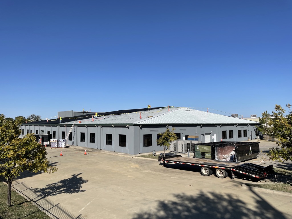 Completed custom charcoal acrylic roof coating on the single lock standing seam roof, Irving, TX