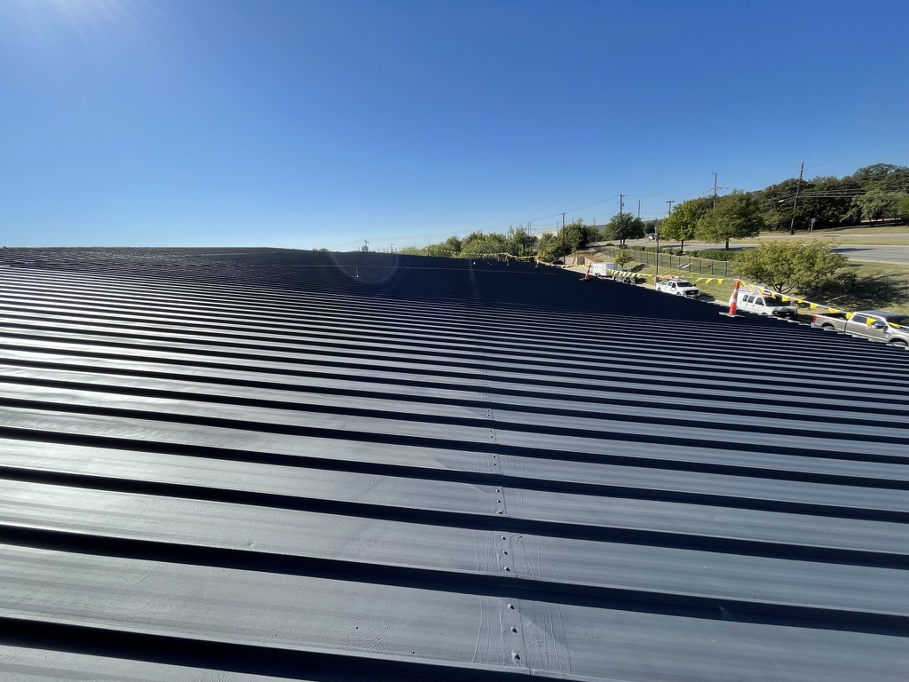 Detail of the finished charcoal coating at a ridge closure, Irving, Texas