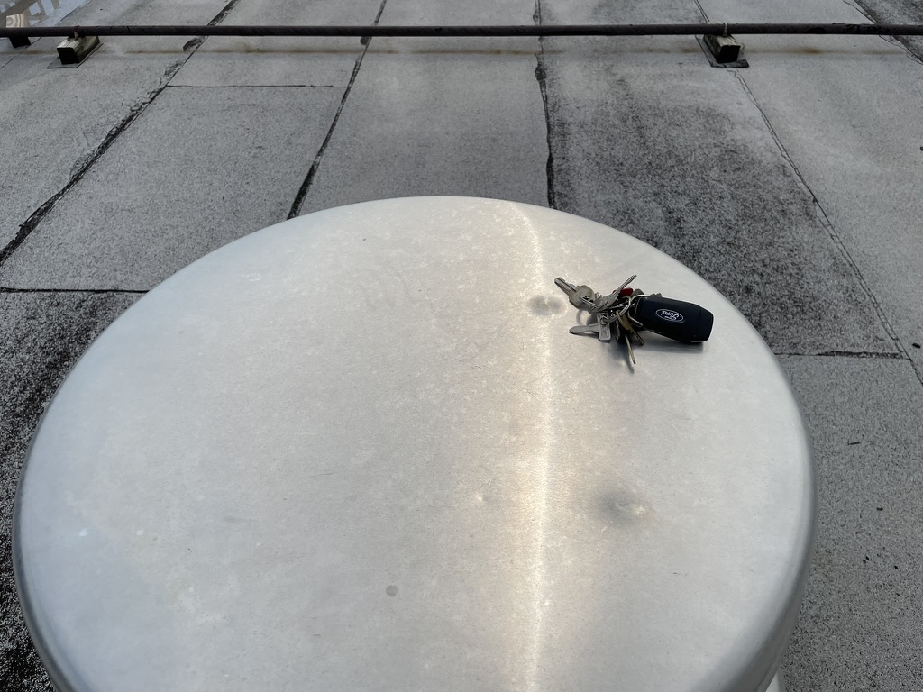 Granule accumulation in the gutter below the roof edge following a hail event, Irving, Texas