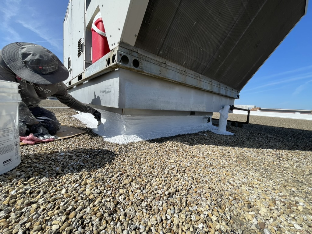 Silicone mastic bonding the parapet wall to the built-up roofing system, N Beltline Rd, Irving