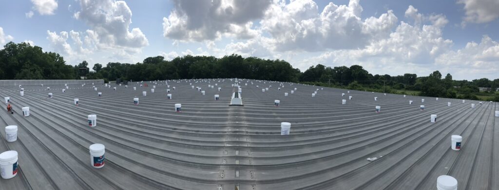 Silicone mastic applied to a roof penetration on the industrial metal roof near the Port of Little Rock
