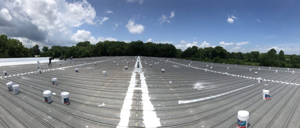 GAF silicone roof coating going down over the 60,000 sq ft metal roof, Fluid Dr, Little Rock, Arkansas