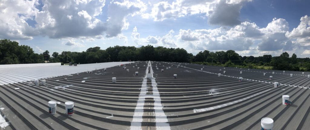 Coating advancing across the industrial retread facility roof in Little Rock, Arkansas