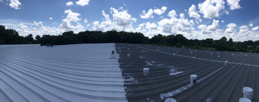 Finished silicone coating meeting the uncoated metal panels mid-project, Little Rock, AR