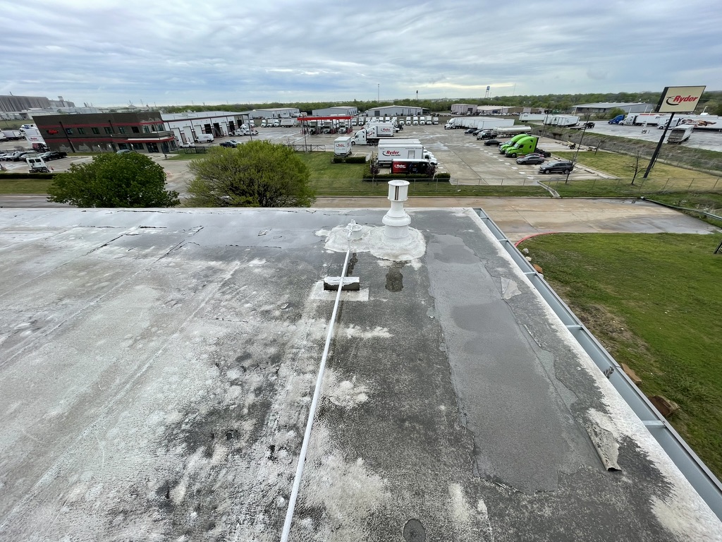 Silicone roof coating bubbling away from the Modified Bitumen membrane, Triad Industrial Park, Saginaw