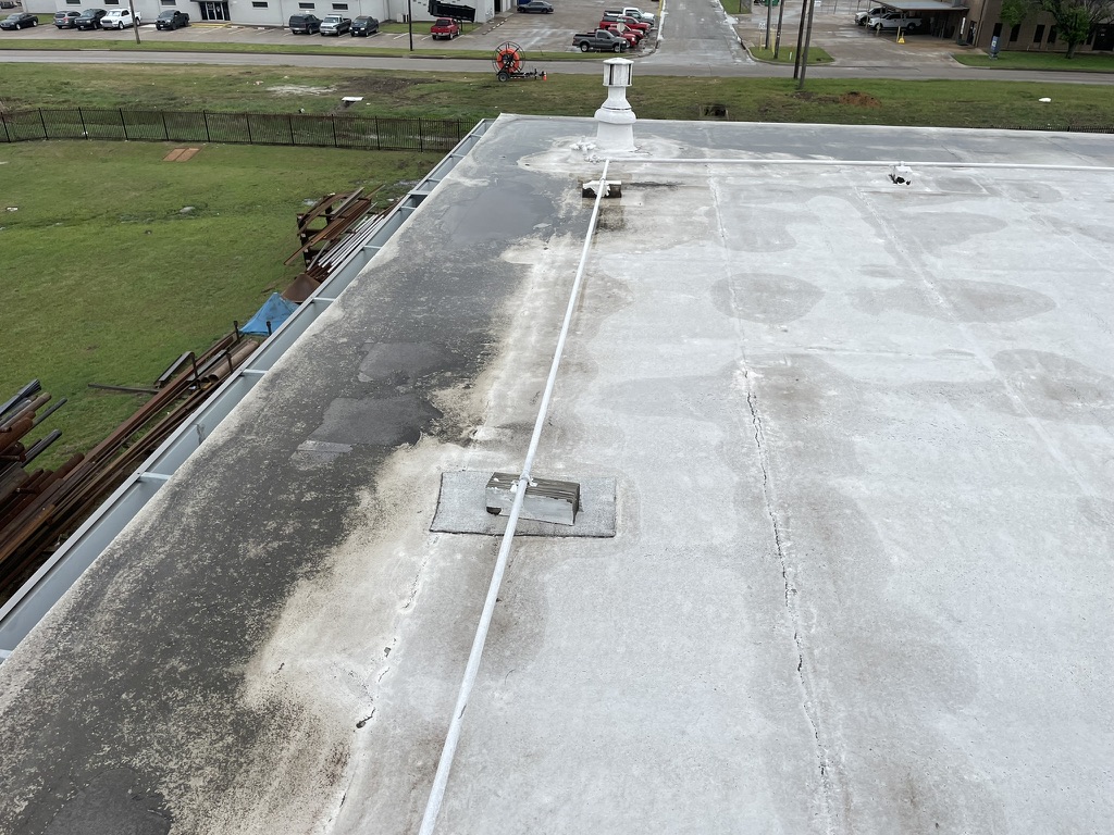 Consistent perimeter ponding caused by compressed, moisture-saturated insulation board, Saginaw, TX