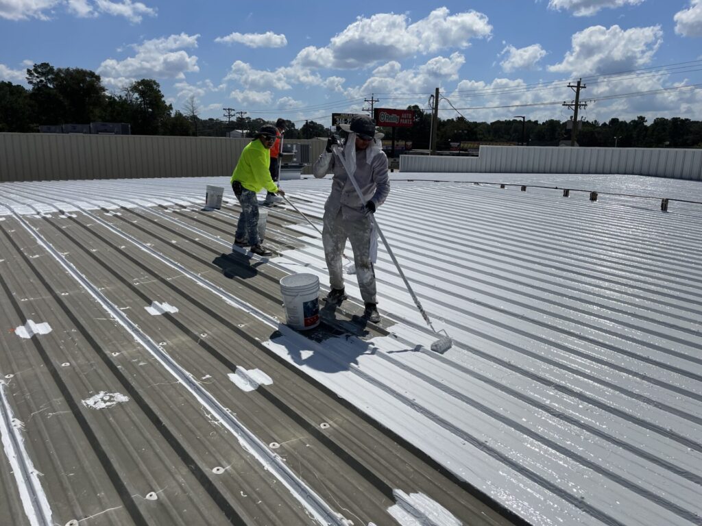 Crew hand-rolling the final silicone coats near completion, Conroe, TX