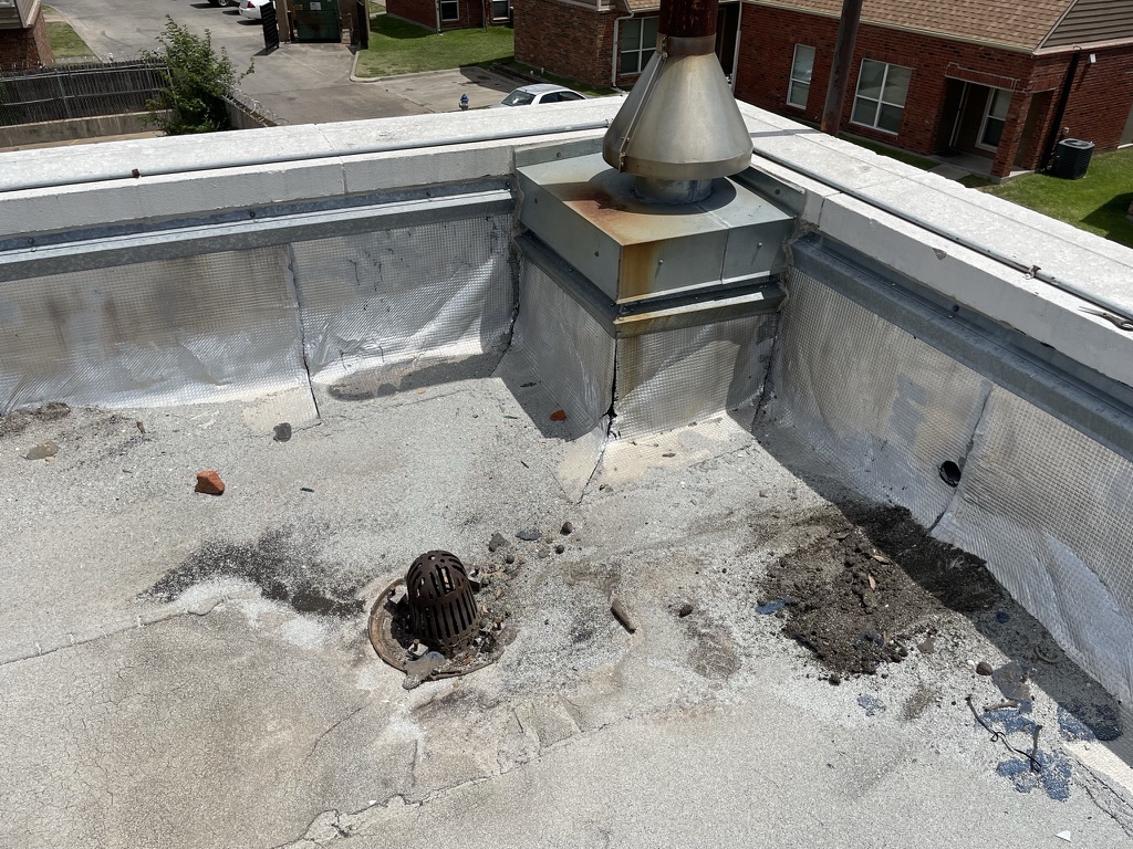 Roof drain and membrane damage from chronic chiller condensation at 7611 Military Pkwy, Dallas, TX