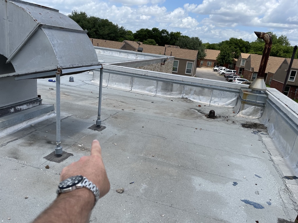 Modified Bitumen membrane staining beneath the rooftop chiller before repair, Dallas, Texas