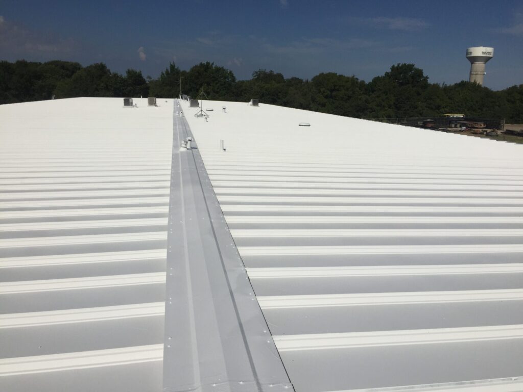 Completed acrylic roof coating at the Carey Cox Company industrial building, 180 Industrial Blvd, McKinney