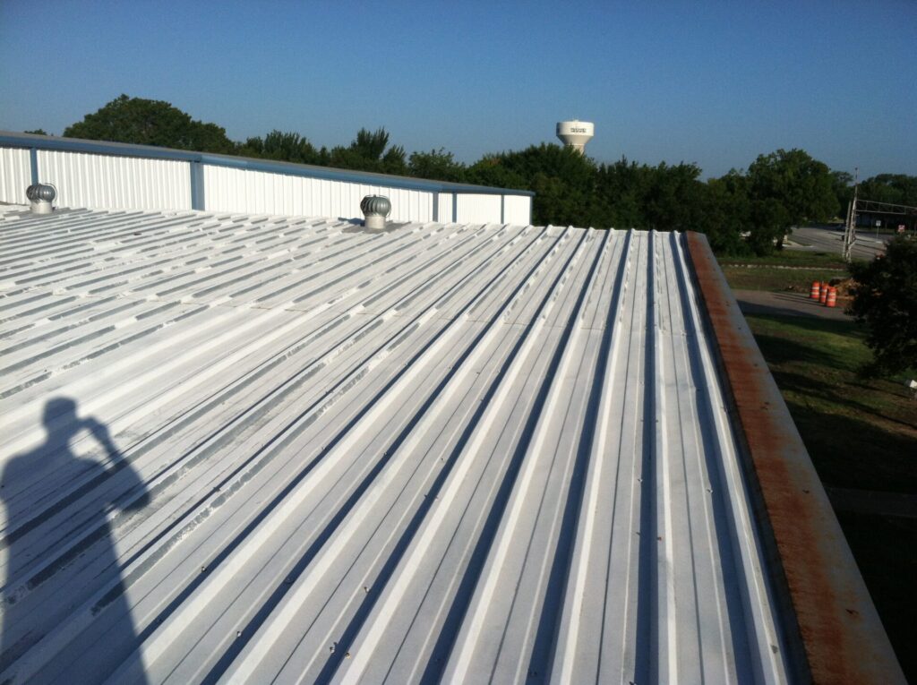 Acrylic elastomeric roof coating over SPF insulation at the McKinney Industrial Park facility